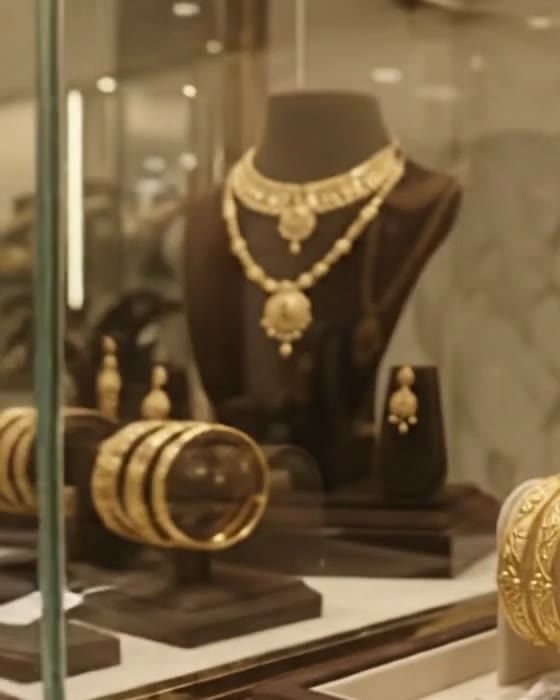 Gold necklaces on display in the showroom